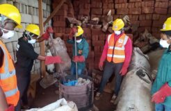 Pierre Sunday supervises the his collaborators as they melt plastic waste for blocks (Photo credit-Pierre Sunday)